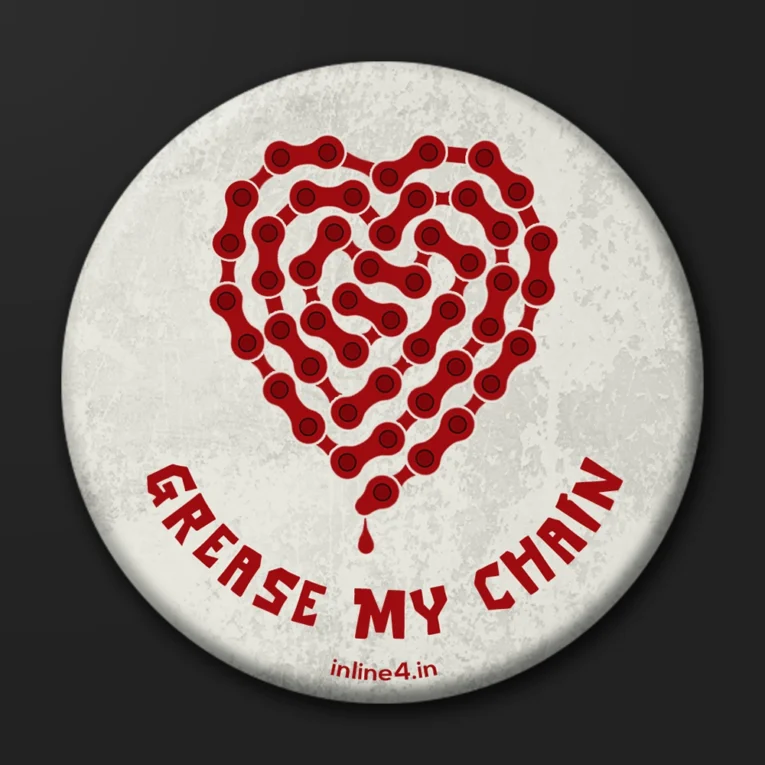 Off-white textured badge with a red motorcycle chain shaped into a dripping heart, "Grease My Chain" text below