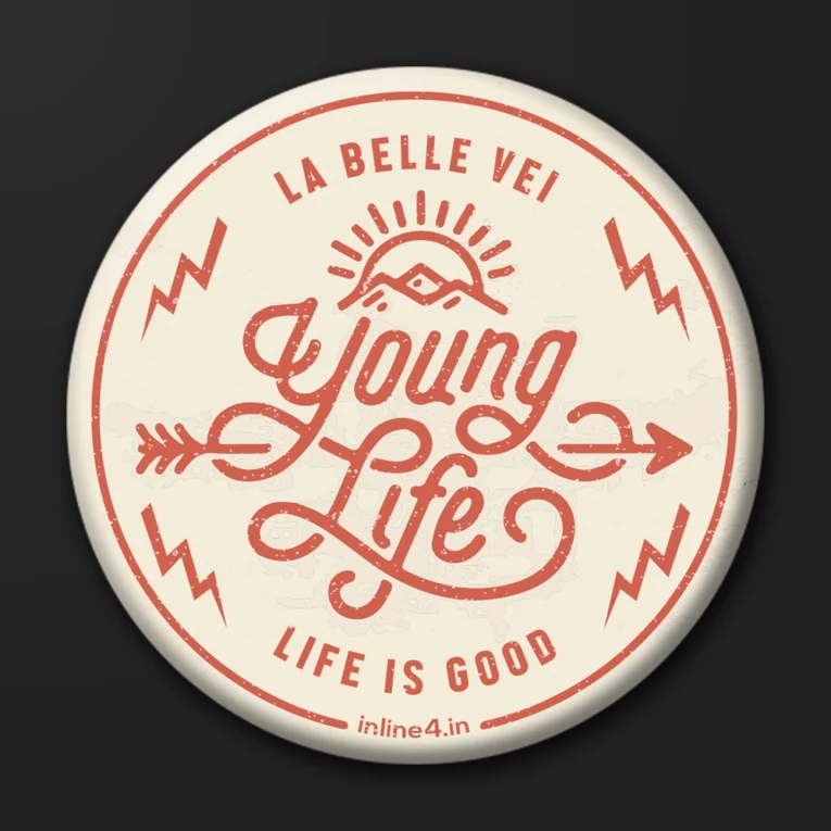 Cream badge with red script text reading "Young Life," a sunrise-over-mountain icon, and text reading "La Belle Vei, Life Is Good"