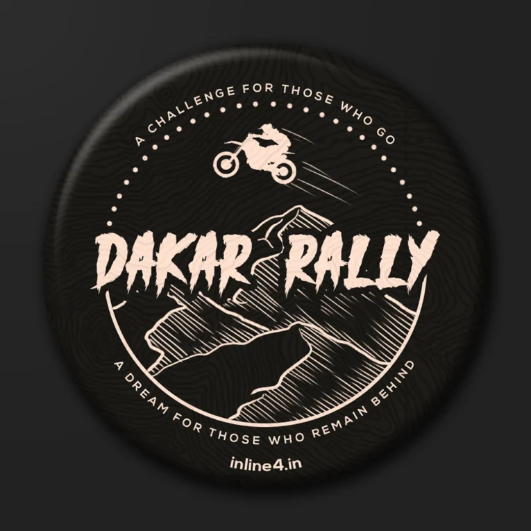 Black badge with a tan illustration of a rider jumping a dirt bike over mountains, bold text reading "Dakar Rally"