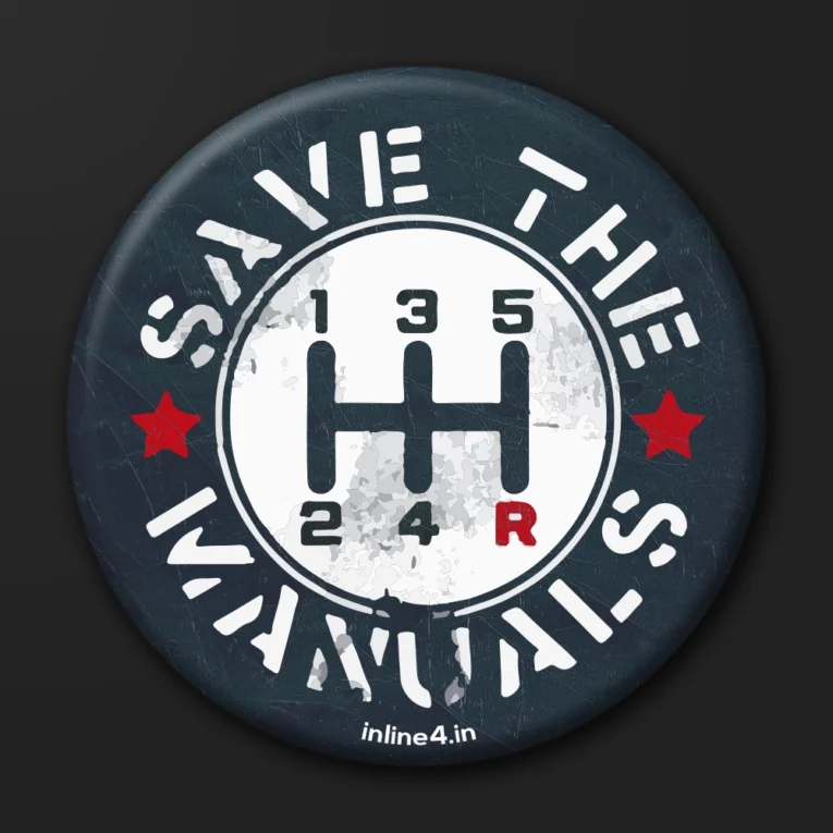 Dark badge with white distressed text reading "Save The Manuals" and a white gear-shift pattern illustration