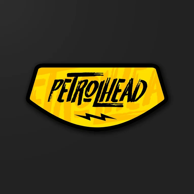 Inline-4 Petrolhead sticker in bold brush lettering with a lightning-bolt accent