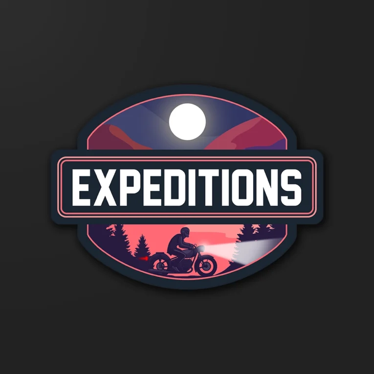 Inline-4 Expeditions sticker illustrating a rider at night with a headlight beam under a full moon