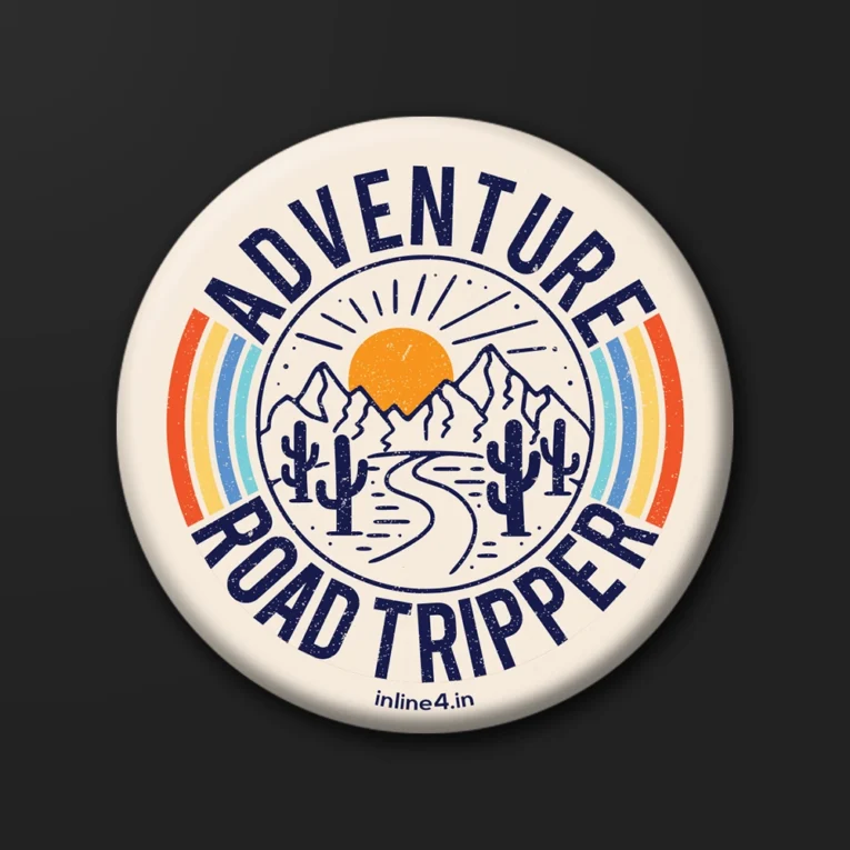 Cream badge with retro rainbow stripes, a navy line-art illustration of mountains, sunrise and a winding road, text reading "Adventure Road Tripper"