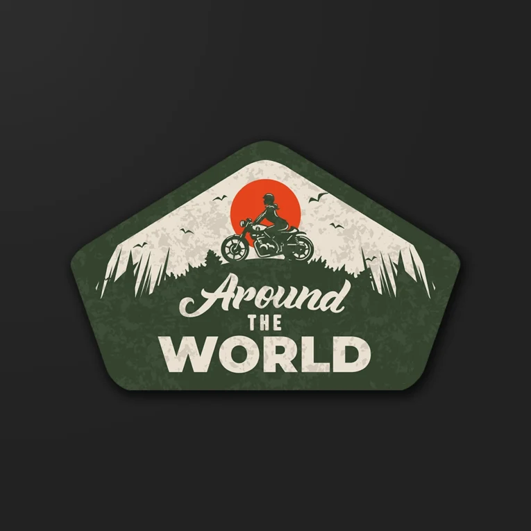 Inline-4 Around the World sticker illustrating a woman rider on a motorcycle against a sunset and mountains