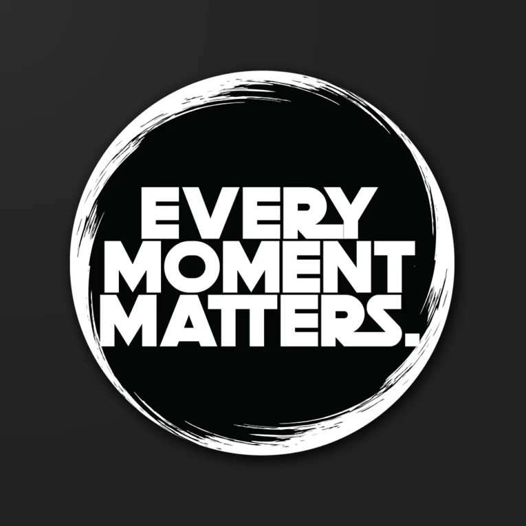 Inline-4 Every Moment Matters sticker in bold white type inside a brushed black circle