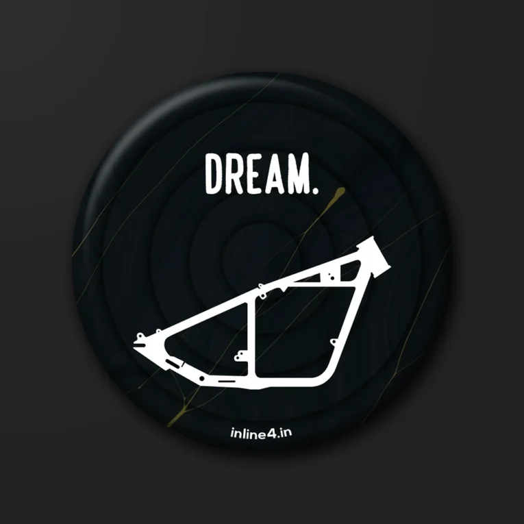 Black badge with the word "Dream" in bold white text and a white line-art illustration of a hardtail motorcycle frame