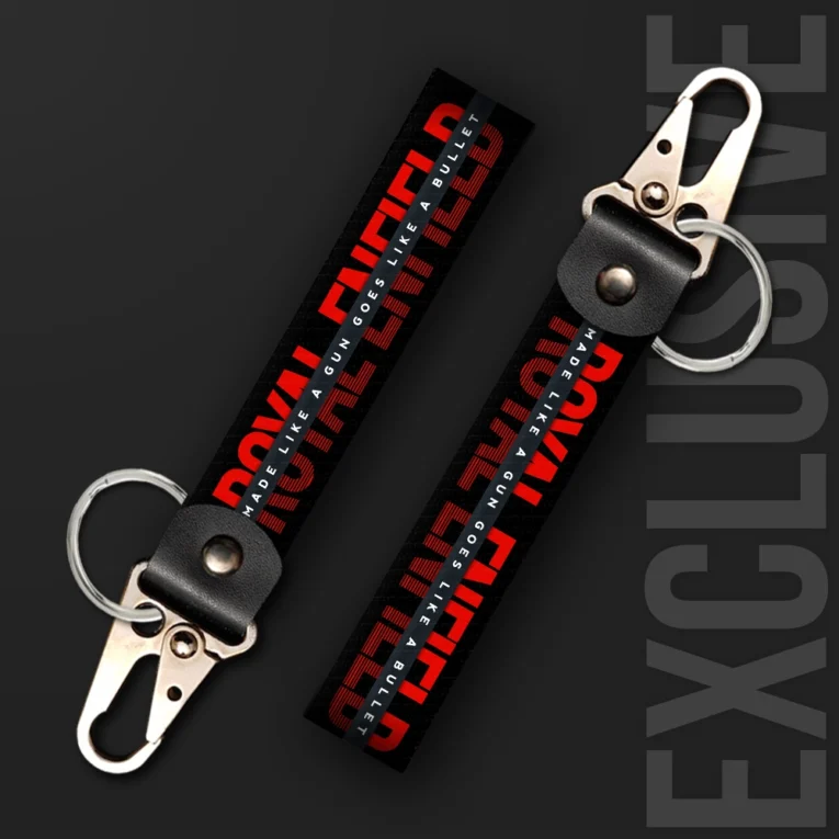 Inline-4 Made like a Gun keychain strap with a bold red 'MADE LIKE A GUN' wordmark on a black textured background, swivel hook clip + keyring