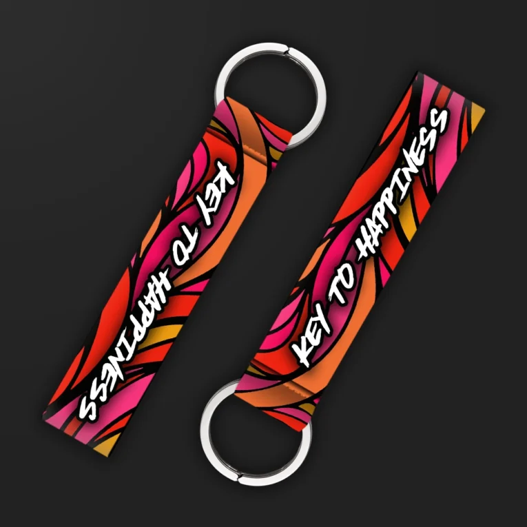 Inline-4 Key to Happiness 2.0 keychain strap with pink and orange flame graphics behind a handwritten 'KEY TO HAPPINESS' script, double keyring