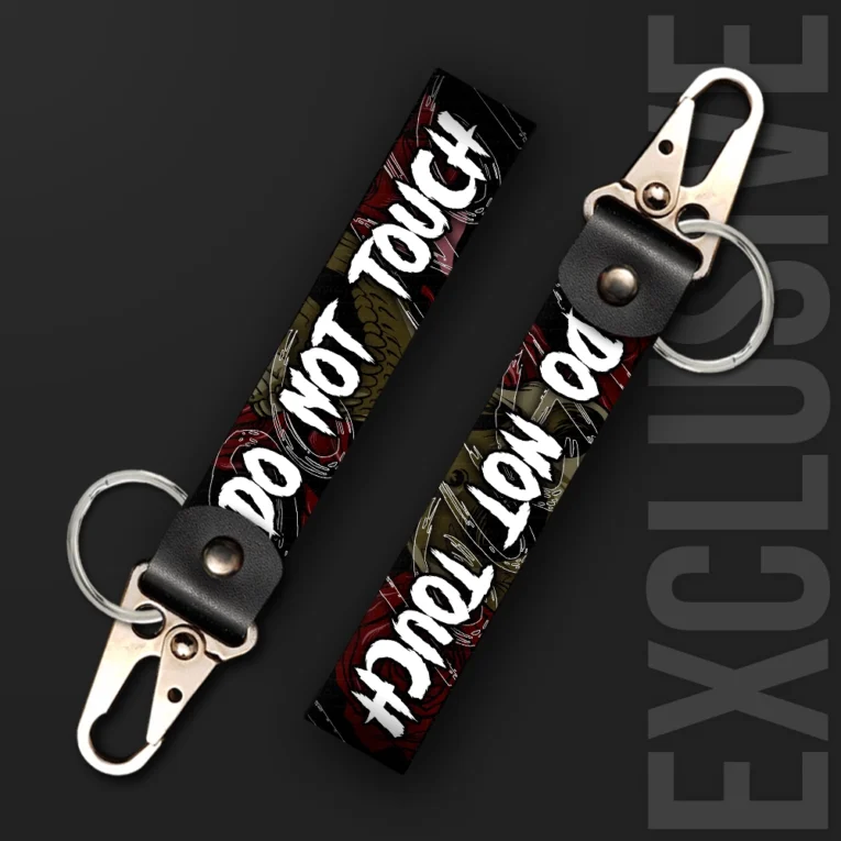 Inline-4 Do not Touch keychain strap with white handwritten 'DO NOT TOUCH' text over a dark gothic snake and rose illustration, swivel hook clip + keyring