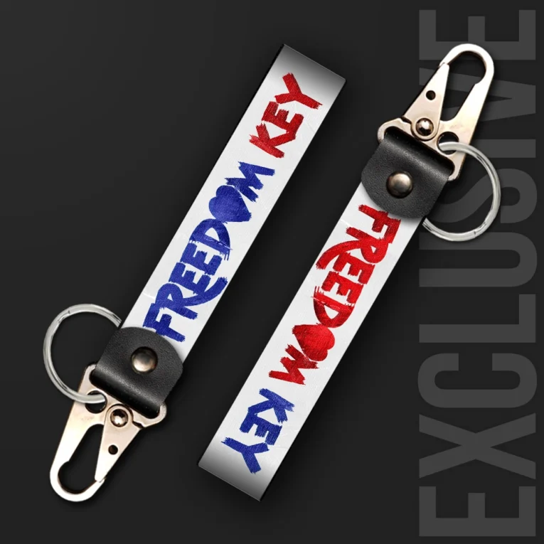 Inline-4 Freedom Key keychain strap with red and blue brush-lettered 'FREEDOM KEY' text on a white background, swivel hook clip + keyring