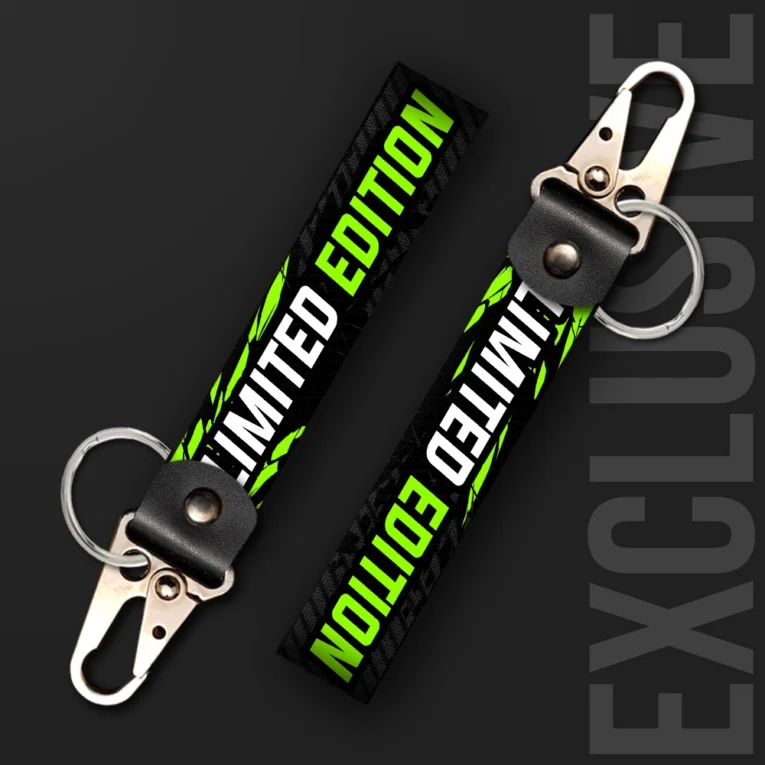 Inline-4 Limited Edition keychain strap with white and green fractured 'LIMITED EDITION' text on a black textured background, swivel hook clip + keyring