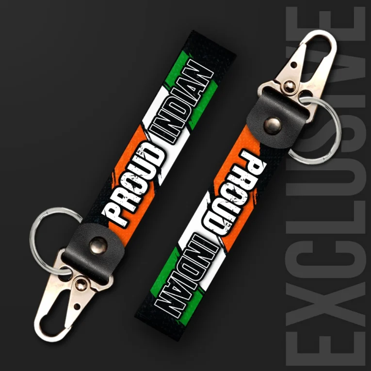 Inline-4 Proud Indian keychain strap with white 'PROUD INDIAN' text over the Indian tricolor flag background, swivel hook clip + keyring