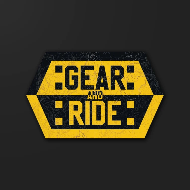 Inline-4 Gear and Ride sticker with bold hexagon lettering over a topographic pattern