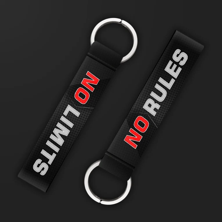 Inline-4 No Rules No Limits keychain strap with bold red and white 'NO RULES NO LIMITS' text on a black textured background, double keyring