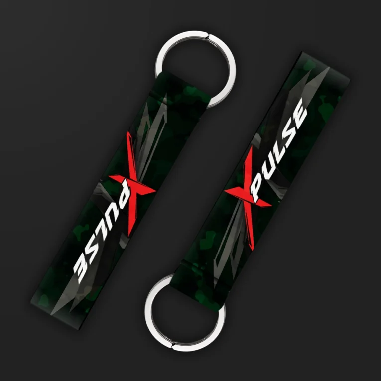 Inline-4 XPulse keychain strap with a red 'X' graphic and white 'PULSE' text over a dark green camo background, double keyring