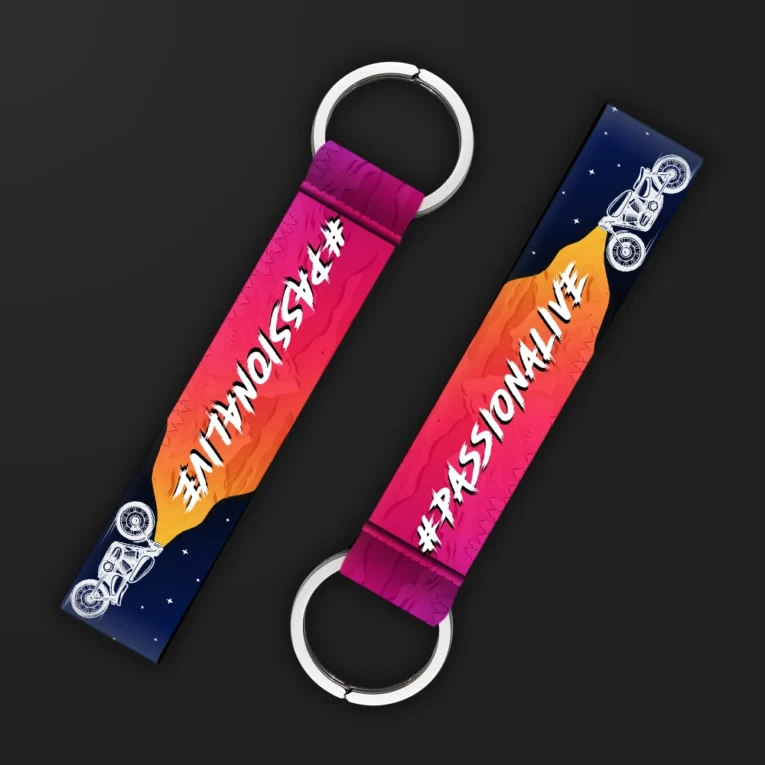 Inline-4 Passionalive keychain strap with white 'PASSIONALIVE' text over a pink-to-orange sunset gradient and a motorcycle silhouette, double keyring