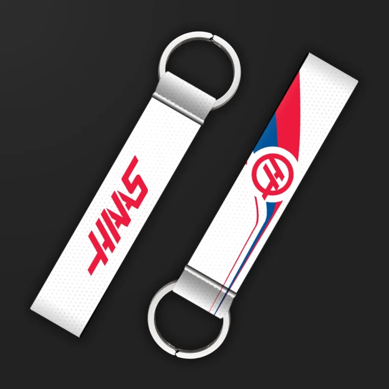 Inline-4 racing tribute keychain strap in white and red with an 'H' emblem and racing team wordmark, double keyring