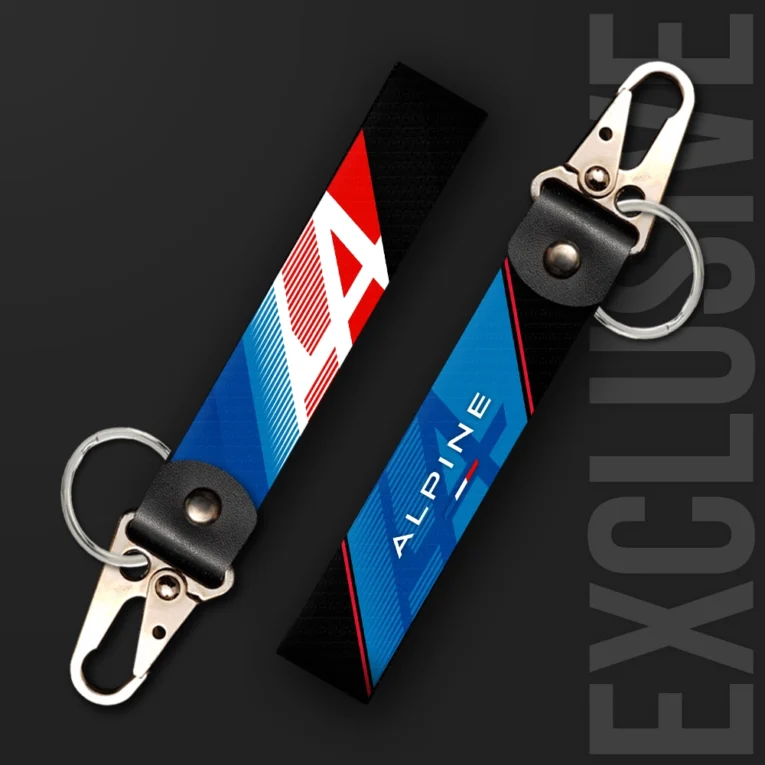 Inline-4 racing tribute keychain strap in blue and red with a stylized 'A' emblem and 'ALPINE' wordmark, swivel hook clip + keyring