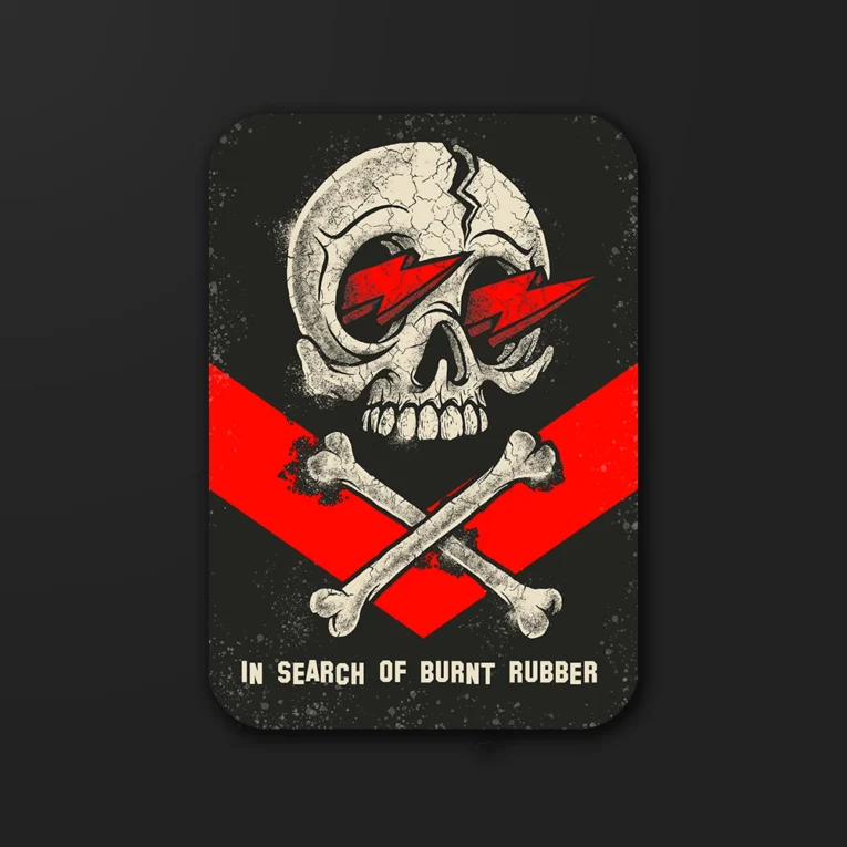 Inline-4 In Search of Burnt Rubber sticker featuring a skull with lightning-bolt eyes and crossed bones