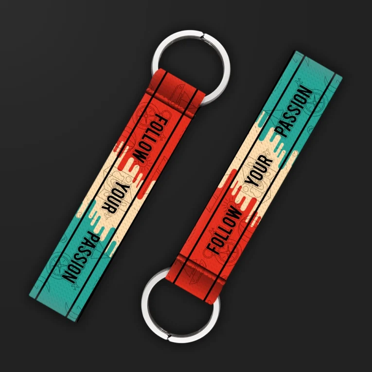 Inline-4 Follow your Passion keychain strap with a vintage teal and red ticket-style 'FOLLOW YOUR PASSION' design, double keyring