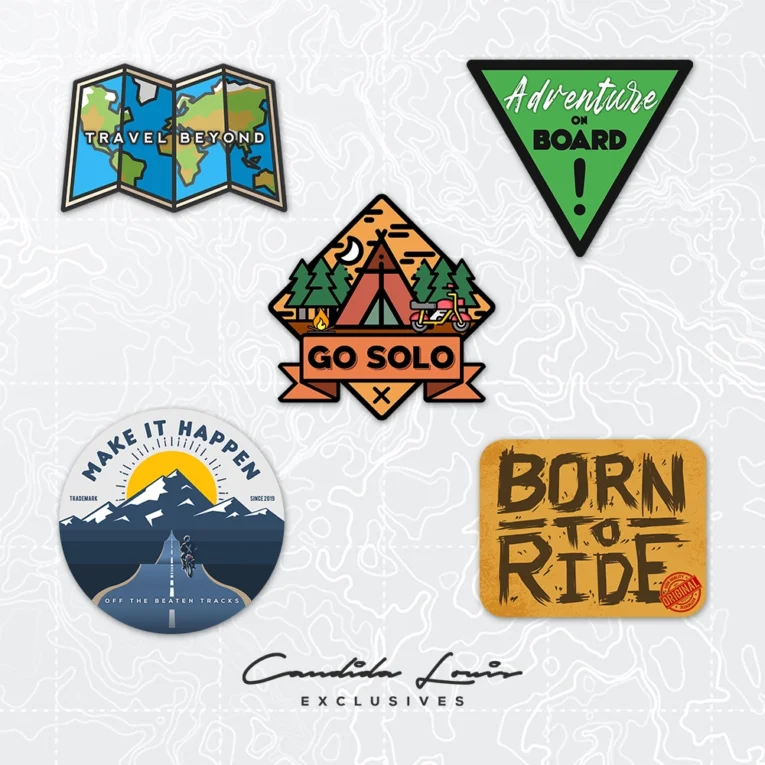 Inline-4 Candida Louis 1.0 Sticker Set close-up, showing the Travel Beyond map, Adventure on Board triangle, Go Solo badge, Make It Happen badge, and Born to Ride stickers