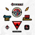 Inline-4 Lets Gear Up Sticker Set close-up, showing the LGU wordmark badge, Burnout triangle, Journey Called Life wordmark, and Adventure is Calling circular badge
