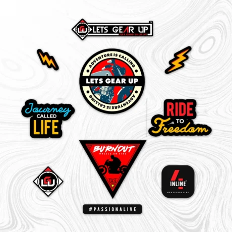 Inline-4 Lets Gear Up Sticker Set close-up, showing the LGU wordmark badge, Burnout triangle, Journey Called Life wordmark, and Adventure is Calling circular badge